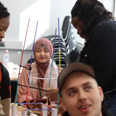 students working on tasks during FutureHER Conference