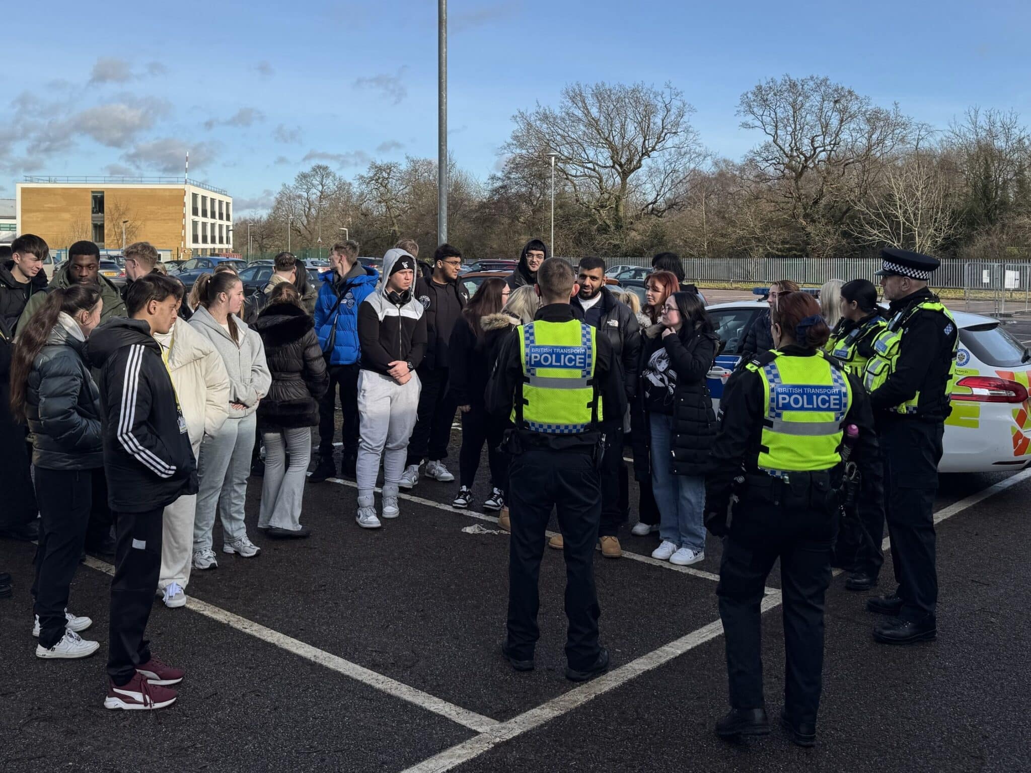 students in a car park with police having a lesson