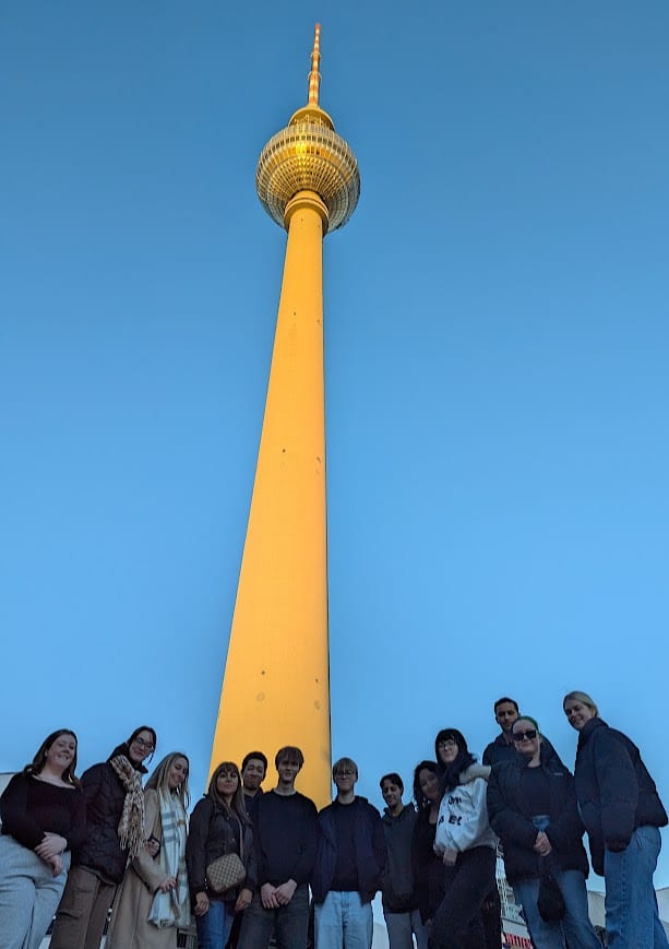 Students looking down on the camera in front of Berlin Tower