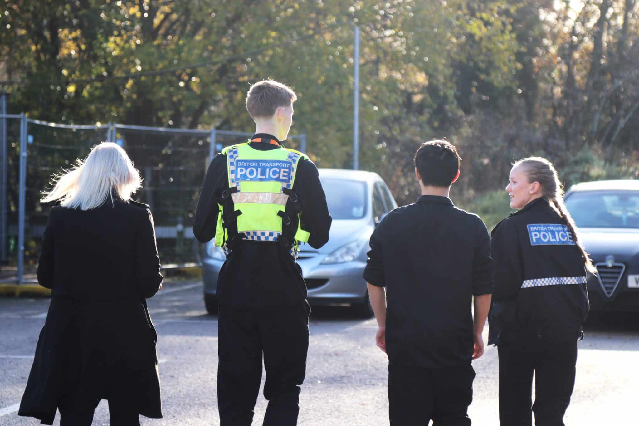 Students wearing british transport police uniform