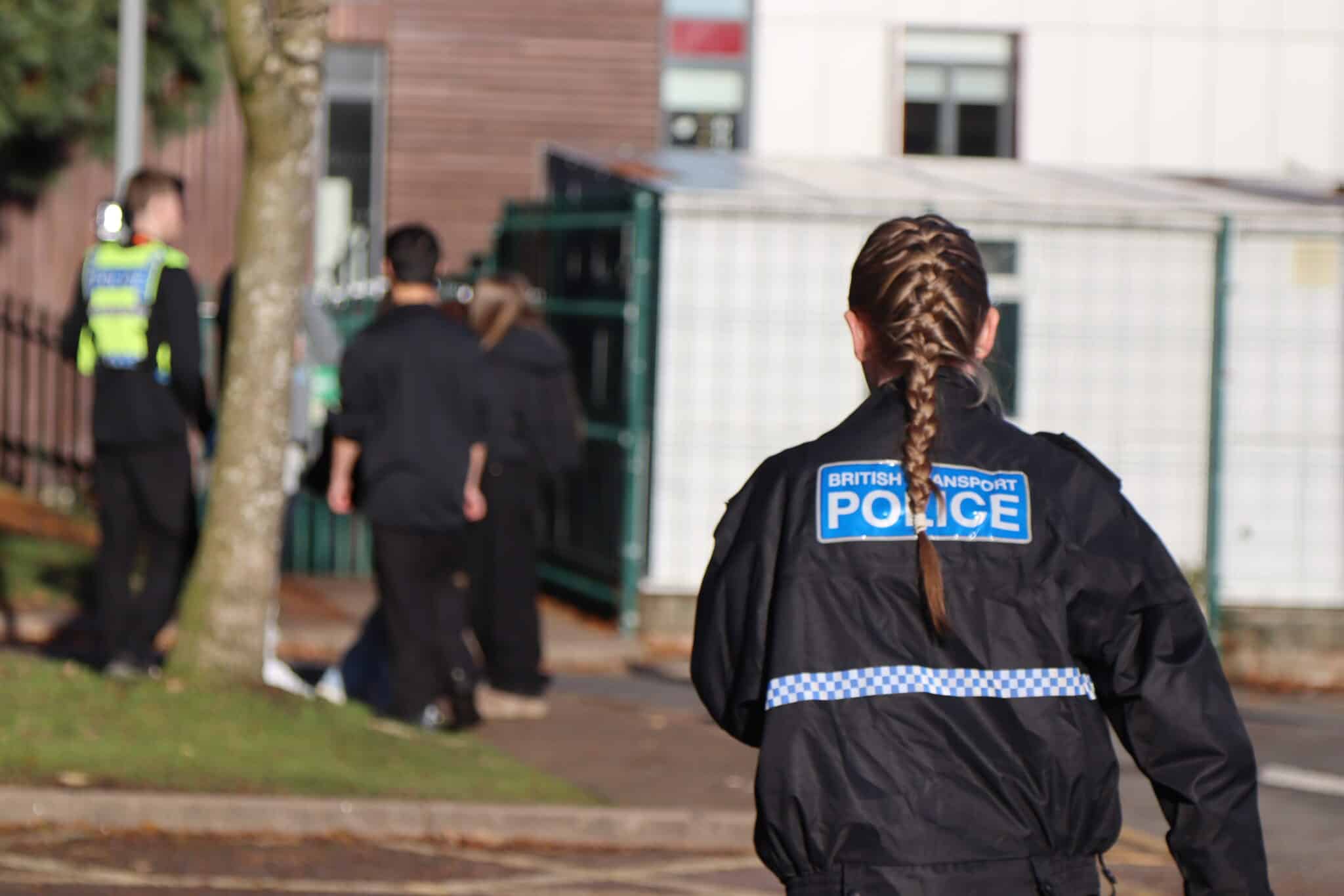 Student wearing british transport police uniform