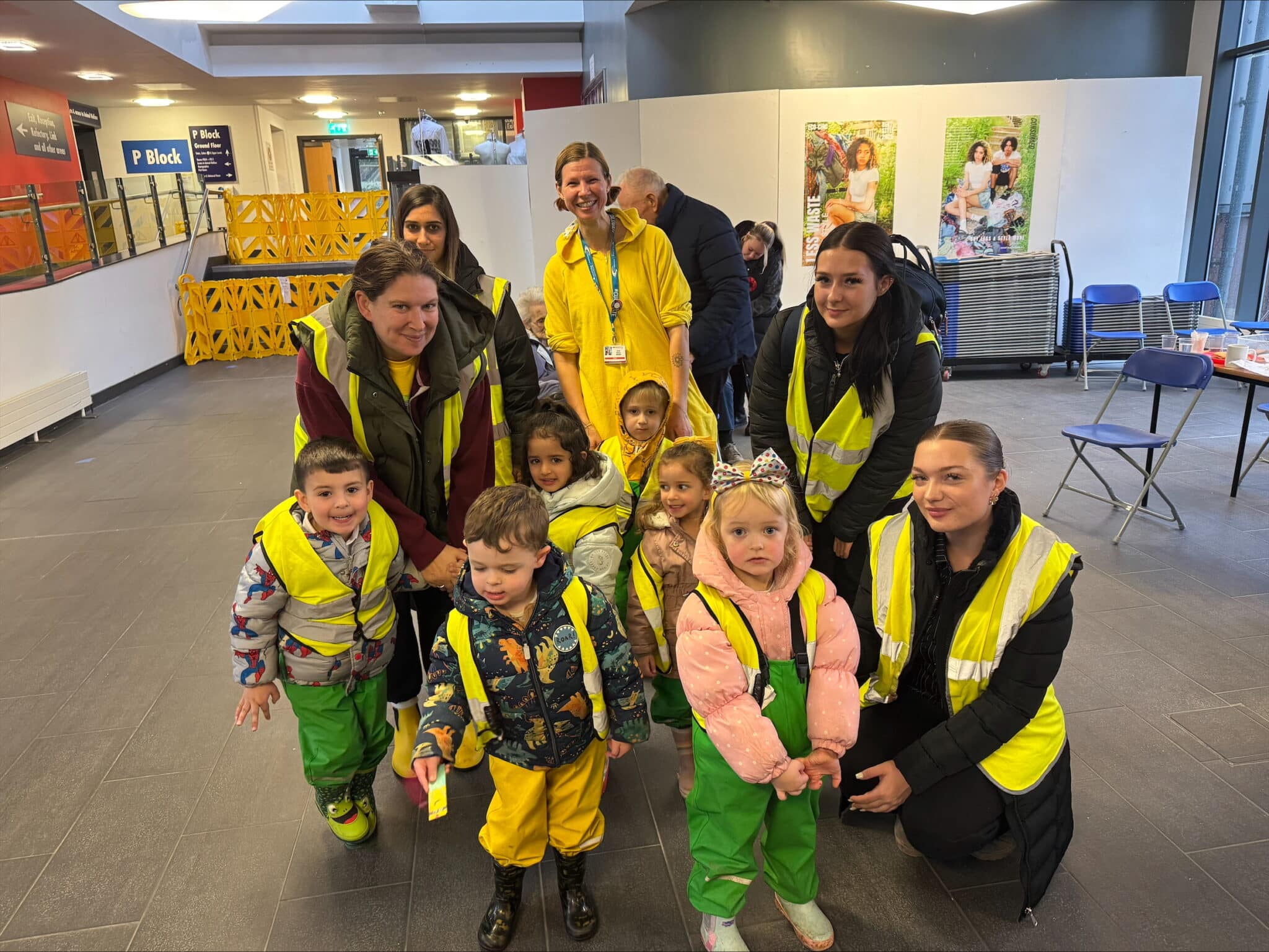 Staff and children from Mad Hatters Day Nursery with students for a Children In Need event